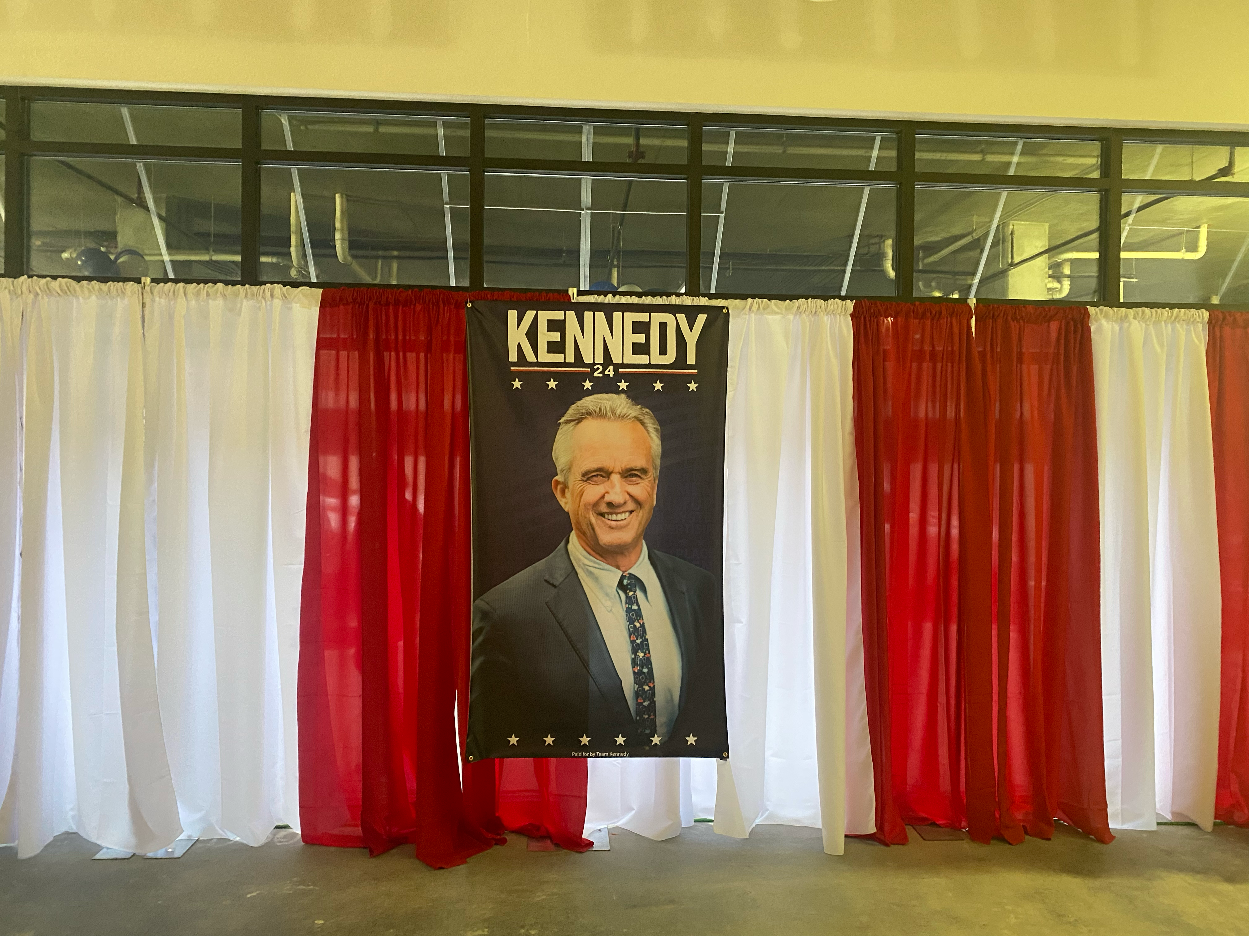 A portrait of Robert F Kennedy hangs from a wall at his New Jersey campaign launch in Elizabeth on Thursday 28 September