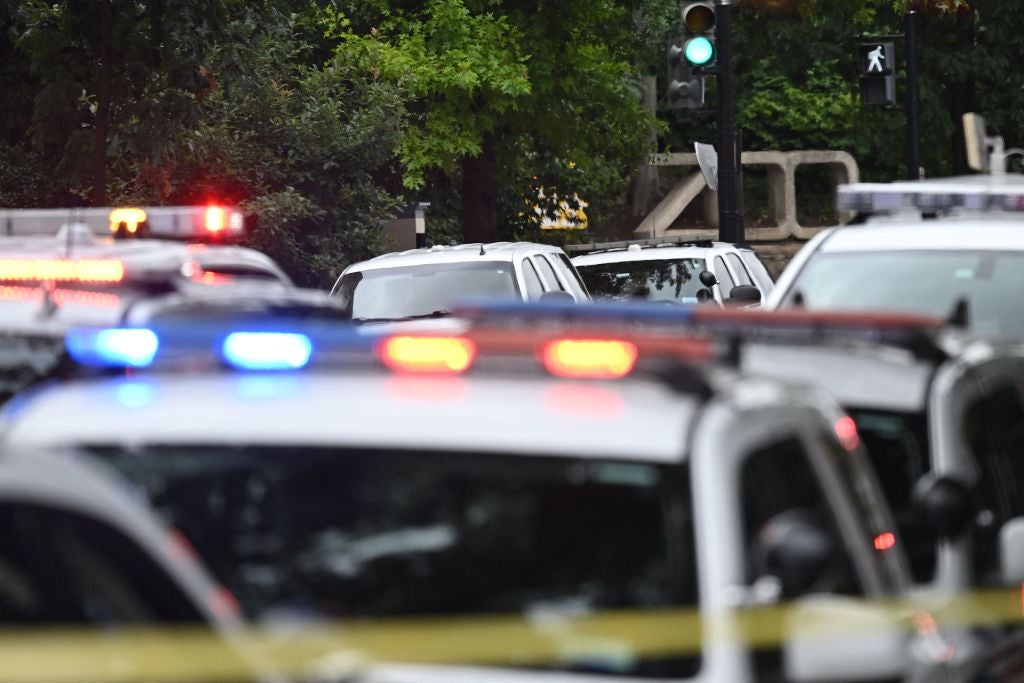 FILE - Police block off a road near the National Zoo in Washington, DC, on August 29, 2023, after a bomb threat caused the zoo to be evacuated.
