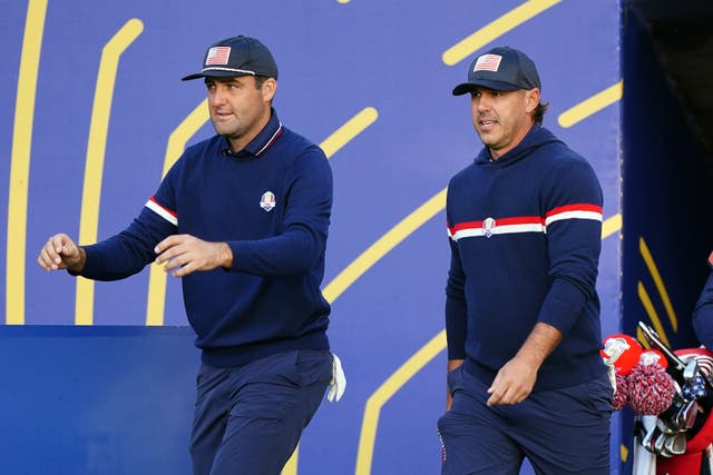 Scottie Scheffler, left, and Brooks Koepka made a nightmare start to day two of the Ryder Cup in Rome (Zac Goodwin/PA)