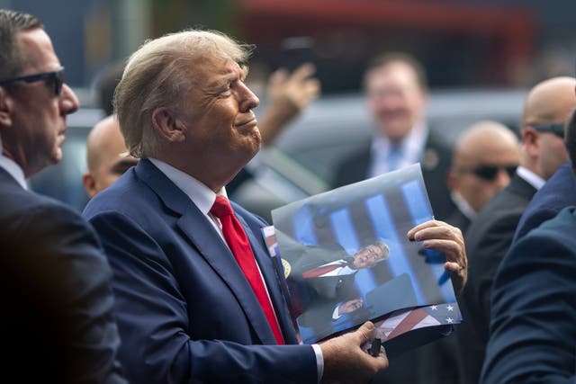 <p>Former U.S. President Donald Trump signs autographs outside a Carvel Ice Cream and Cake Shop during the California GOP convention on September 29, 2023 in Los Angeles, California</p>