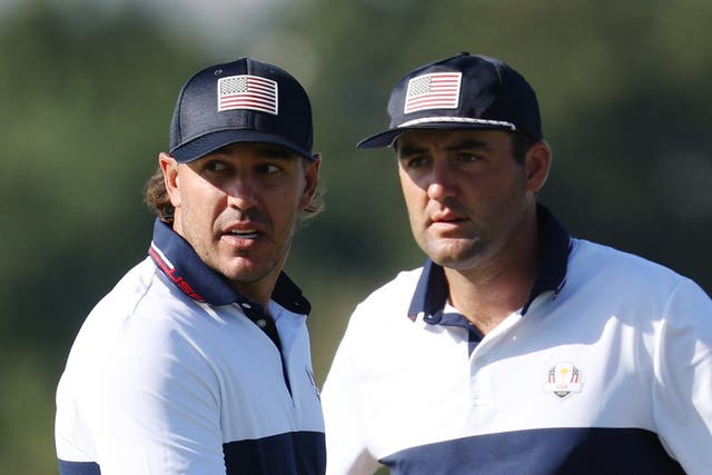 <p>Brooks Koepka and Scottie Scheffler react upon losing their match to Viktor Hovland and Ludvig Aberg</p>