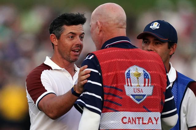 Rory McIlroy argues with Joe LaCava (Mike Egerton/PA)