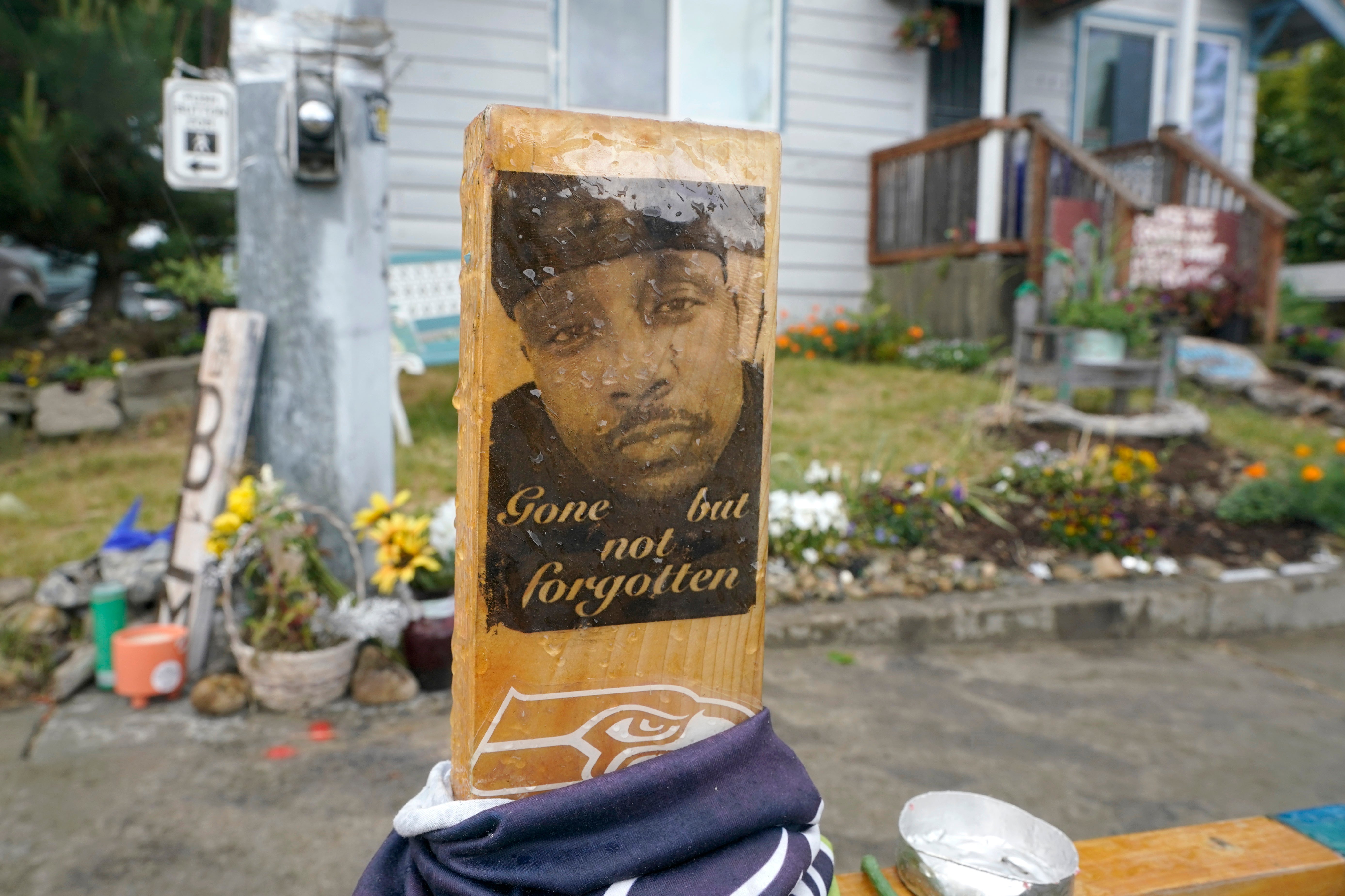 A sign is displayed at a memorial in Tacoma, Washington, where Manuel “Manny” Ellis died
