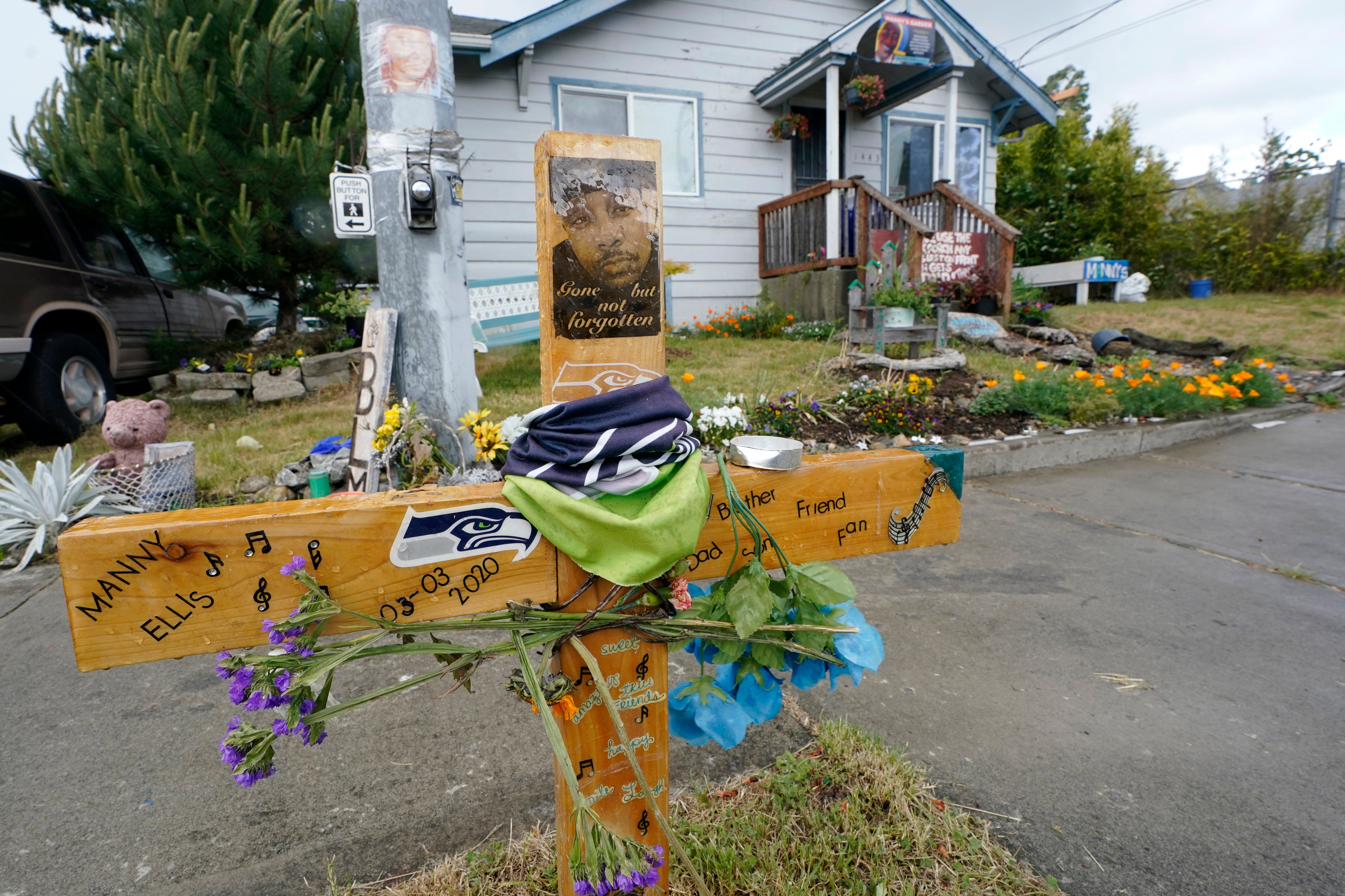 A sign that reads “Gone but not forgotten” is shown on a cross displayed May 27, 2021, at a memorial