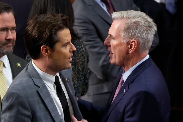  U.S. House Republican Leader Kevin McCarthy (R-CA) (L) talks to Rep.-elect Matt Gaetz (R-FL) in the House Chamber after Gaetz voted present during the fourth day of voting for Speaker of the House