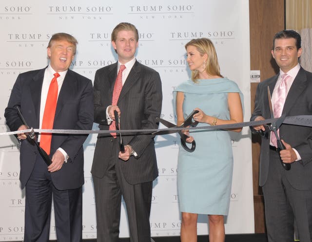 <p>Donald Trump and his children Eric Trump, Ivanka Trump and Donald Trump Jr. attend the ribbon cutting ceremony for Trump SoHo New York in April, 2010</p>