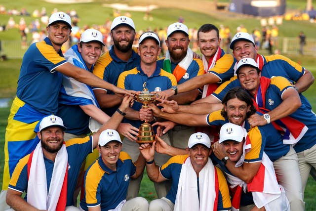 Captain Luke Donald and his players hold the Ryder Cup (David Davies/PA)