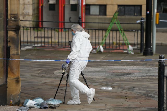Police activity outside the Victoria Theatre in Fountain Street, near to the scene of a triple stabbing in Commercial Street in Halifax, West Yorkshire (Danny Lawson/PA)
