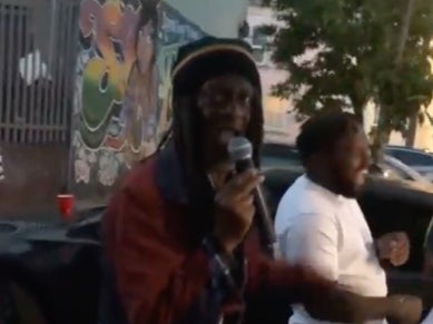 A video sent to The Independent shows Mr Brown MCing at a sound system outdoor party as smiling dancers film him