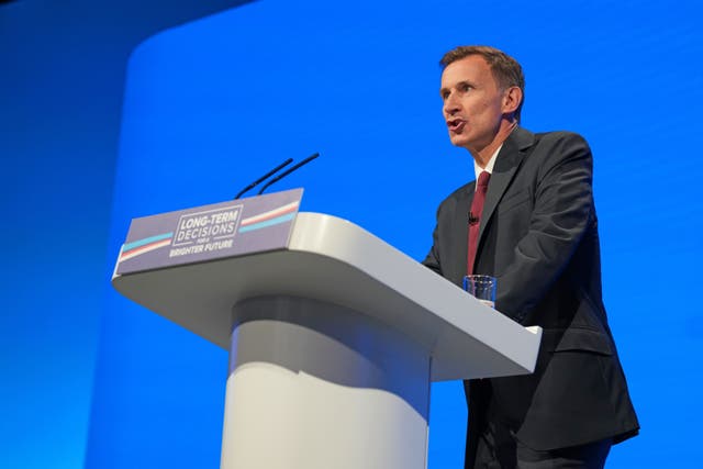 <p>Jeremy Hunt delivers his speech during the Conservative Party annual conference at the Manchester Central convention complex (Danny Lawson/PA)</p>