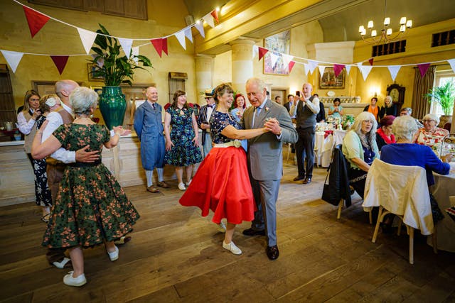 Charles dances with Bridget Tibbs during a Jubilee tea dance hosted by The Prince’s Foundation to mark the Platinum Jubilee at Highgrove in 2022 (Ben Birchall/PA)