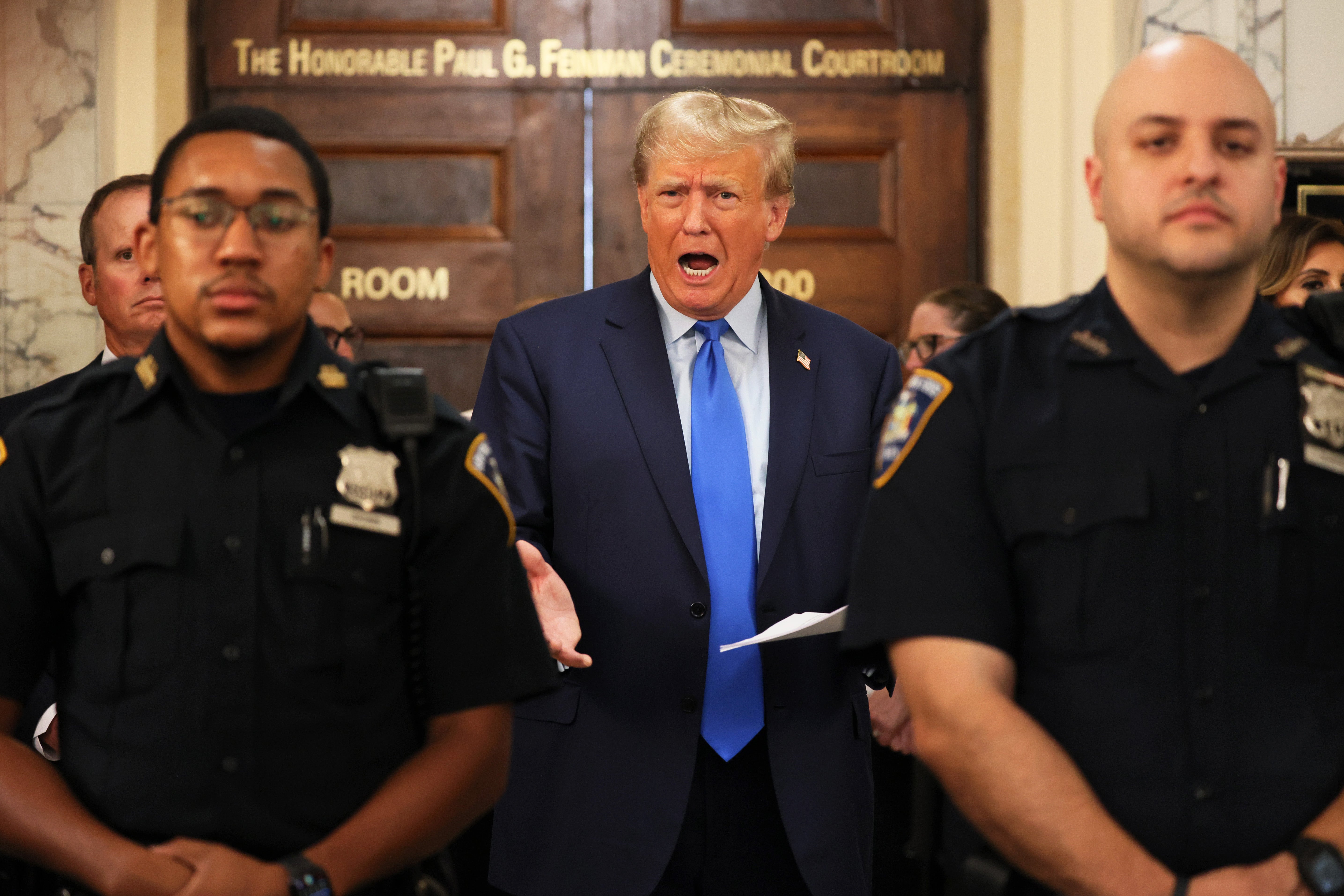 Donald Trump speaks to media on 2 October during a recess on the first day of a trail stemming from a fraud lawsuit from New York Attorney General Letitia James.