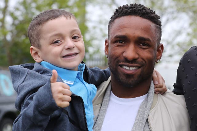 Jermain Defoe with Bradley Lowery (Owen Humphreys/PA)