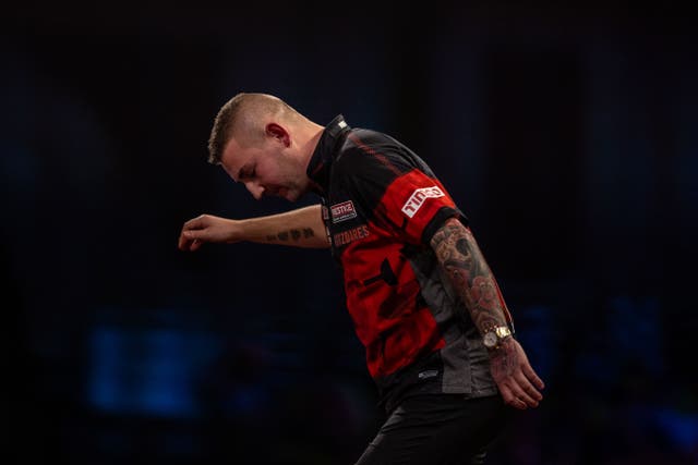 Nathan Aspinall suffered a first-round defeat in the World Grand Prix of Darts (Steven Paston/PA)
