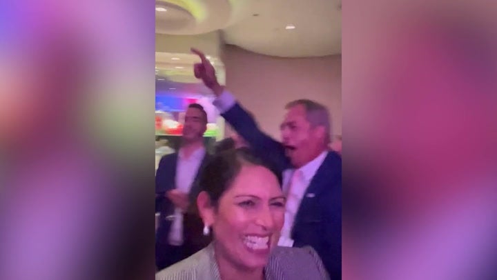 <p>Priti Patel dances with Nigel Farage at Conservative Party conference</p>
