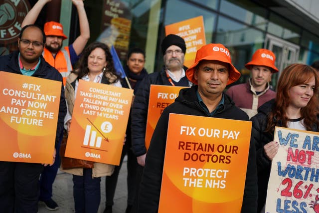 Junior doctors and medical consultant members of the British Medical Association on the picket line outside Queen Elizabeth Hospital, Birmingham (Jacob King/PA)