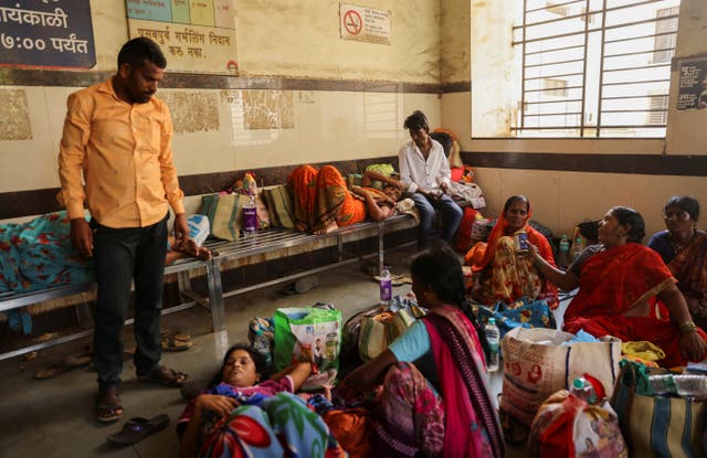 <p>Relatives of patients admitted at the Shankarrao Chavan Government Medical College and Hospital are seen inside the hospital, in Nanded</p>