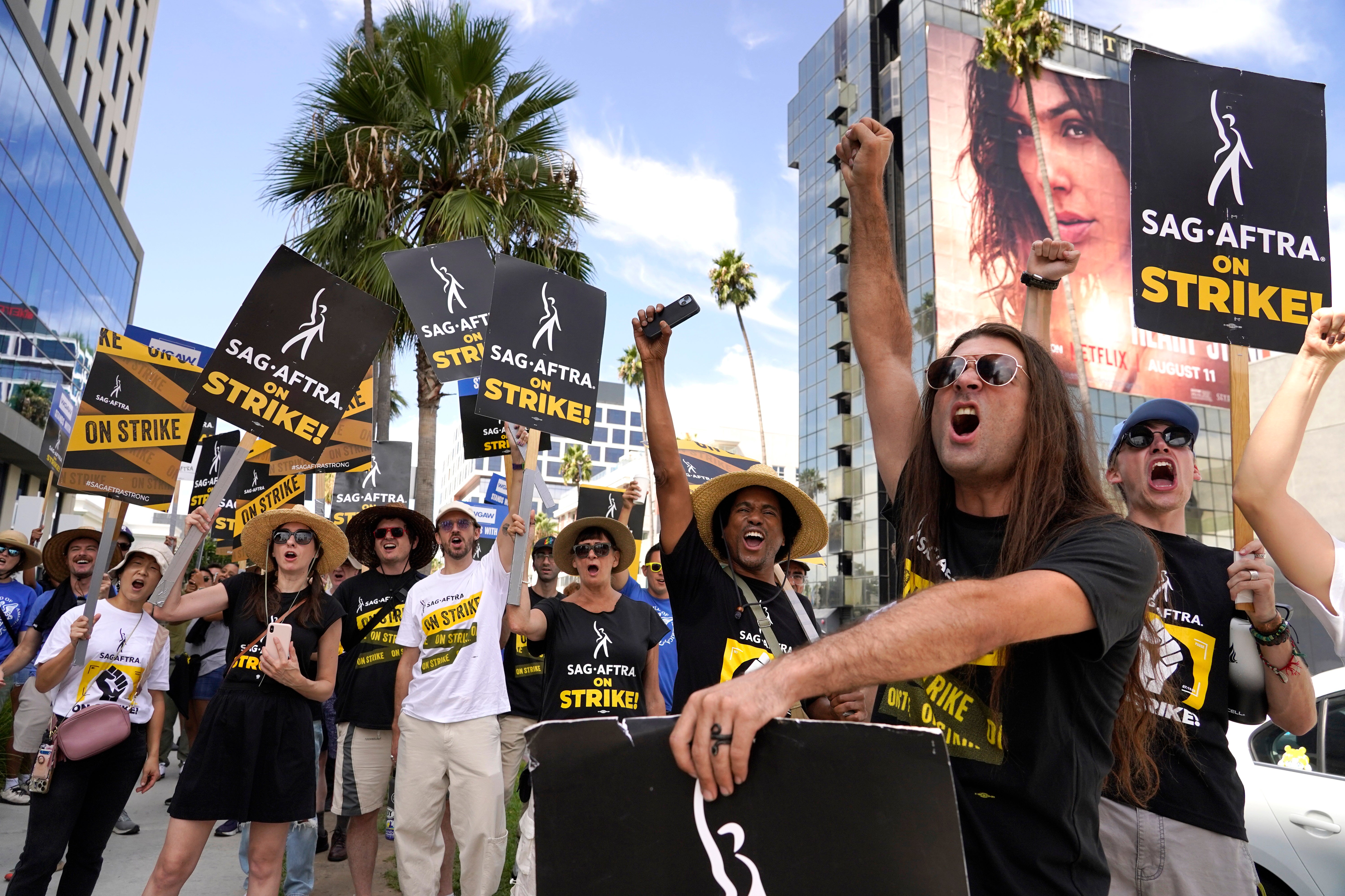 WGA members celebrate their win after the historic writers’ strike