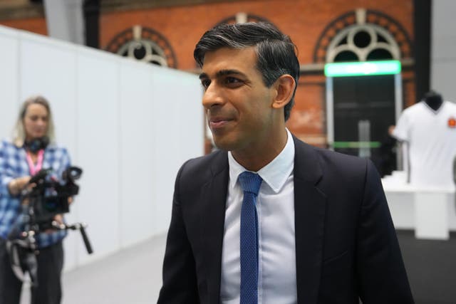 Prime Minister Rishi Sunak tours the Exhibitors’ Hall, at the Manchester Central convention complex, during the Conservative Party annual conference (Carl Court/PA)