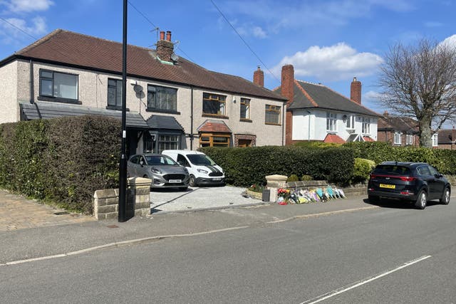 Floral tributes left outside a house on Hemper Lane, Greenhill, Sheffield, following the death of Marcia Grant (Dave Higgens/PA)