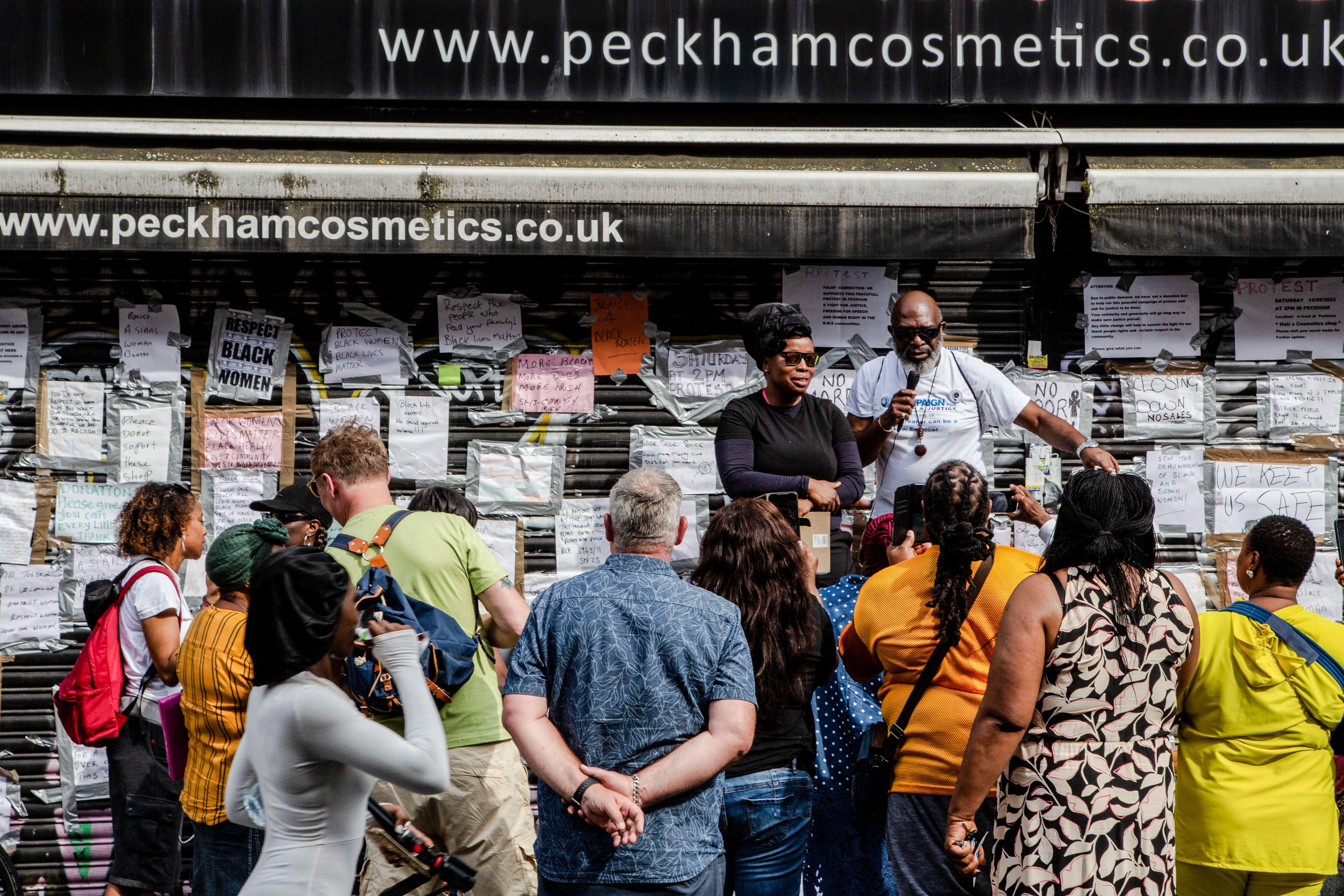 Demonstrators gathered outside Peckham Hair and Cosmetics shop