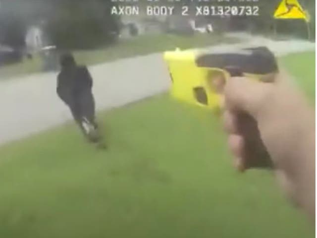 <p>Sheriff’s deputy Hunter Sullivan aims a Taser weapon at Le’Keian Woods during a chase</p>