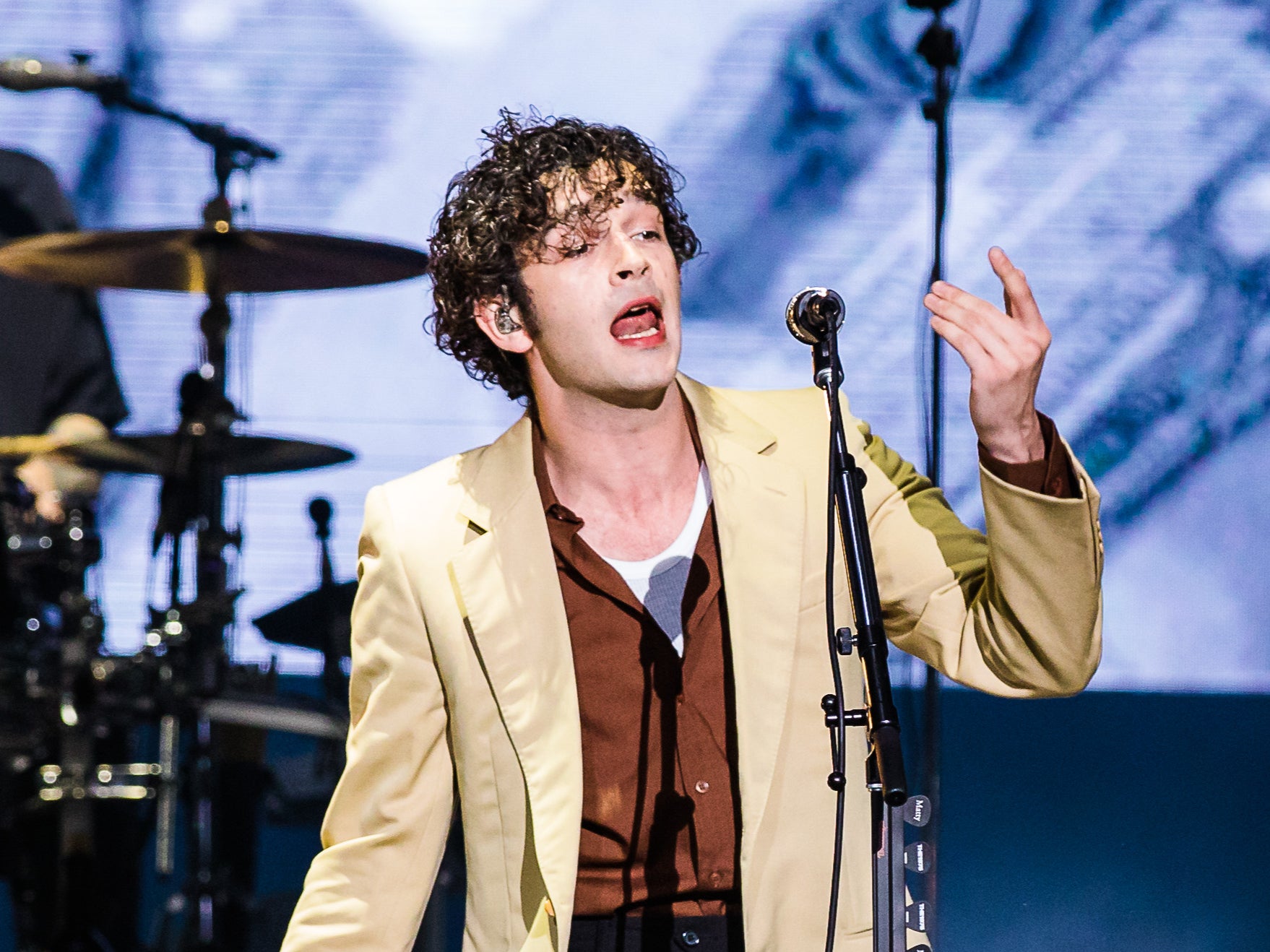 Matty Healy of The 1975 sparked uproar after kissing his bandmate onstage at a festival in Malaysia (Photo by Mauricio Santana/Getty Images)