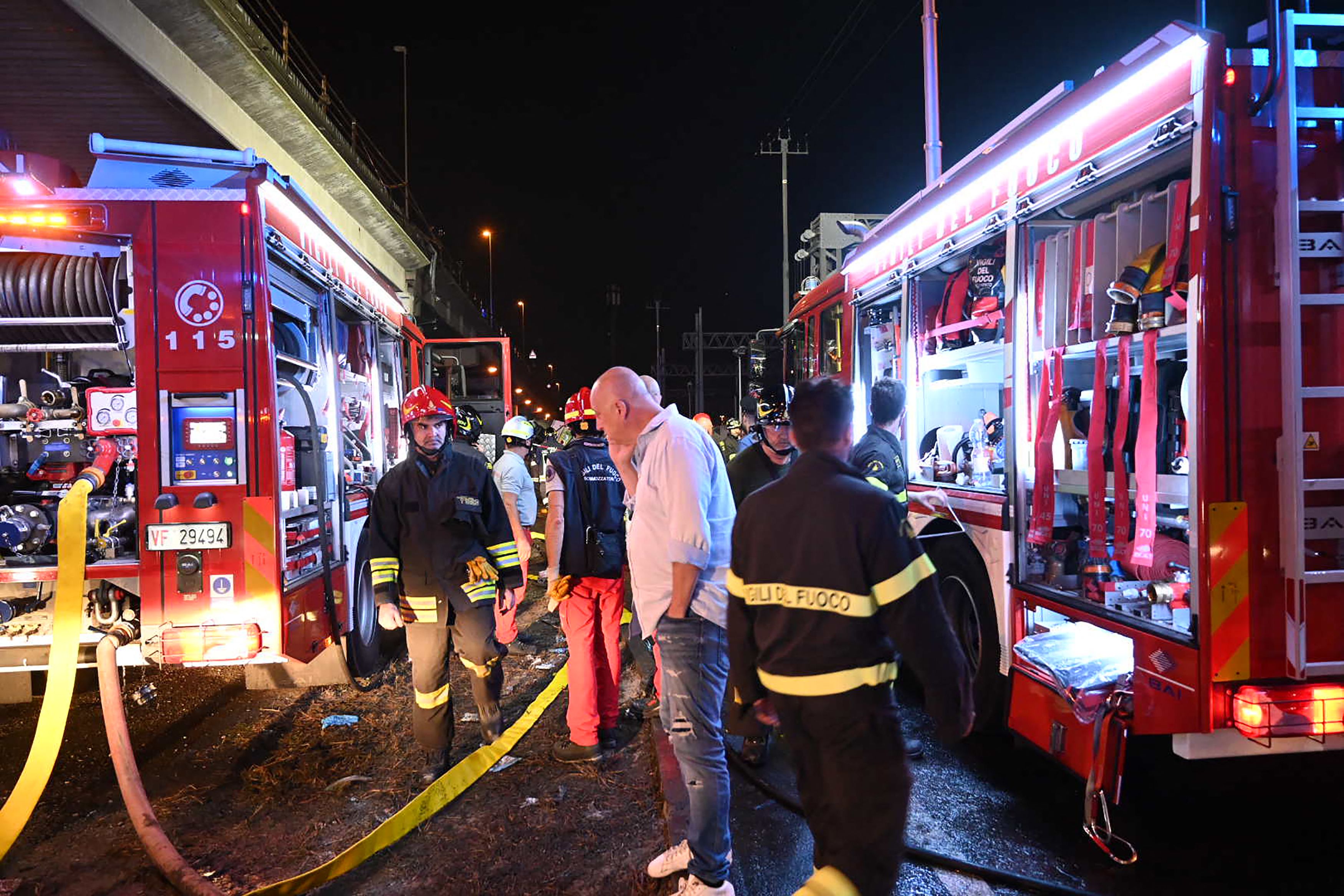 Firefighters work on the site of a bus accident on October 03, 2023 in Mestre, near Venice.