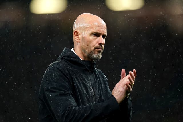 Erik ten Hag applauds the Manchester United fans following defeat to Galatasaray (Martin Rickett/PA)