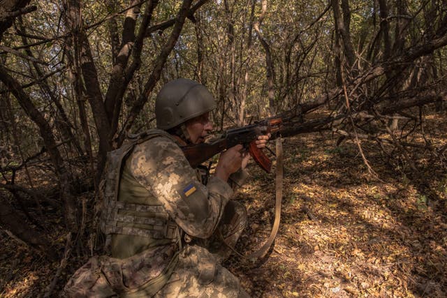 <p>A Ukrainian member of the OPFOR (opposing force) battalion practices assault on enemy positions during a military training in the Donetsk region</p>