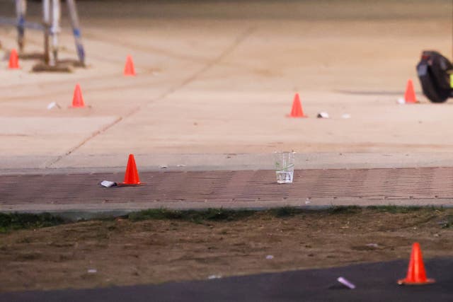<p>Evidence markers are pictured outside a building at Morgan State University </p>
