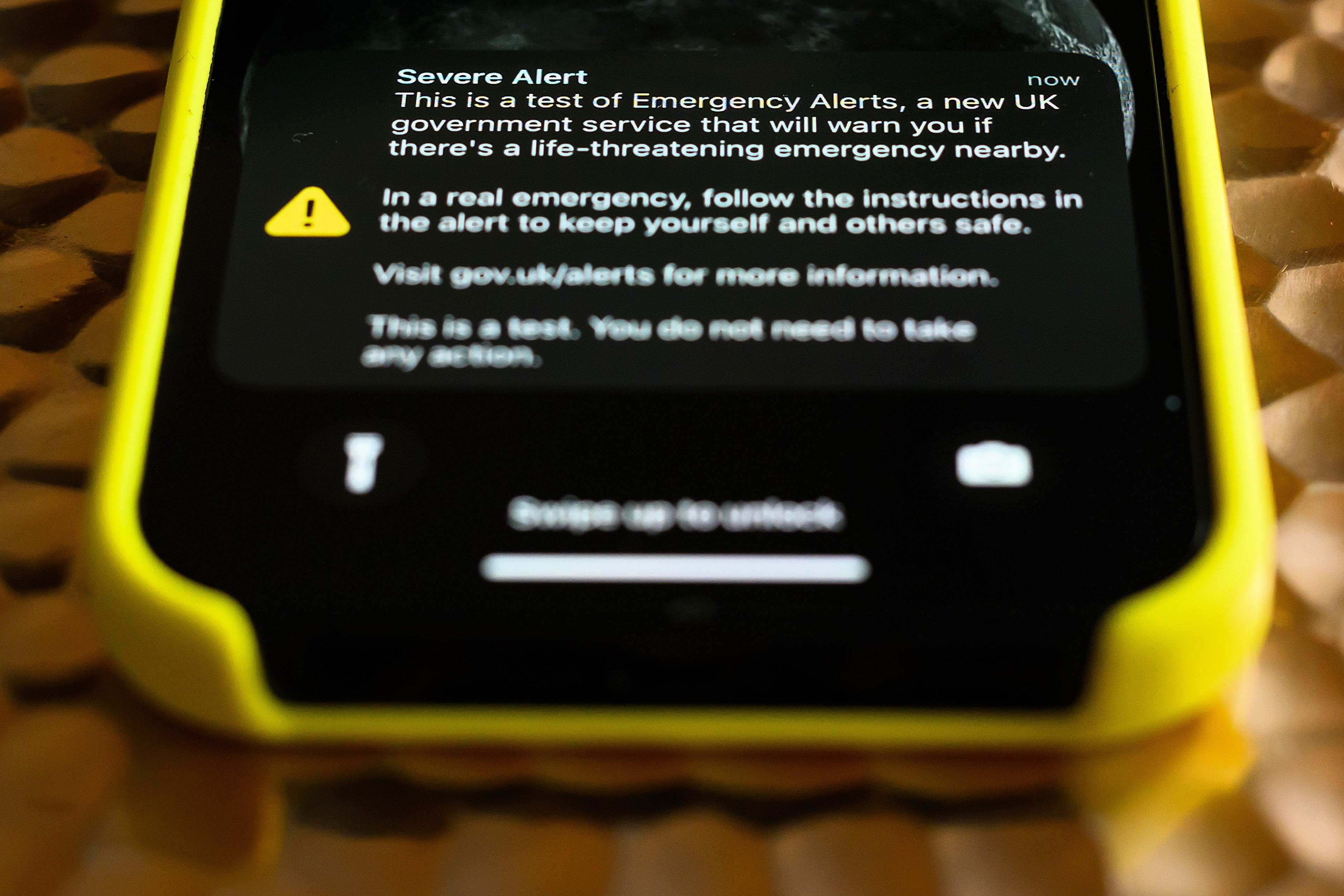 A mobile phone displays a nationwide public alert system test message on 23 April, 2023 in London, United Kingdom