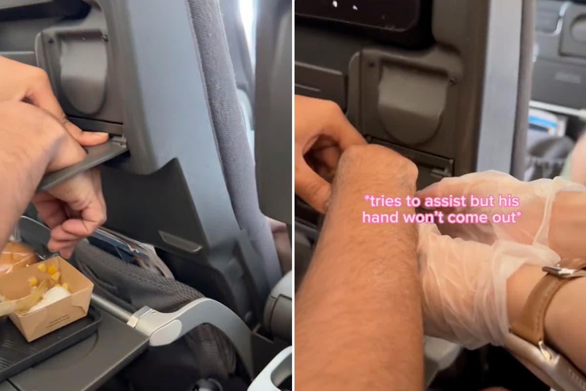 Man gets hand stuck in cup holder on flight to Vietnam after seeing if it would fit