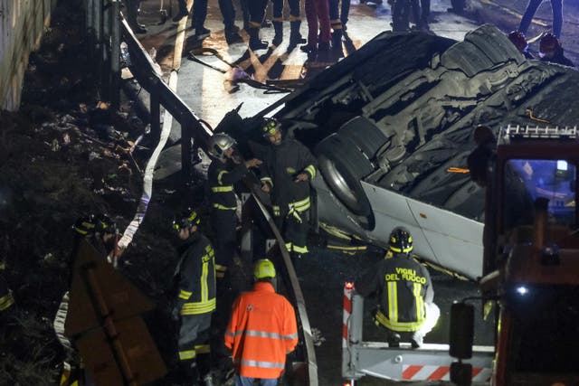 <p>Emergency crew members work at the scene after a bus accident near Venice </p>
