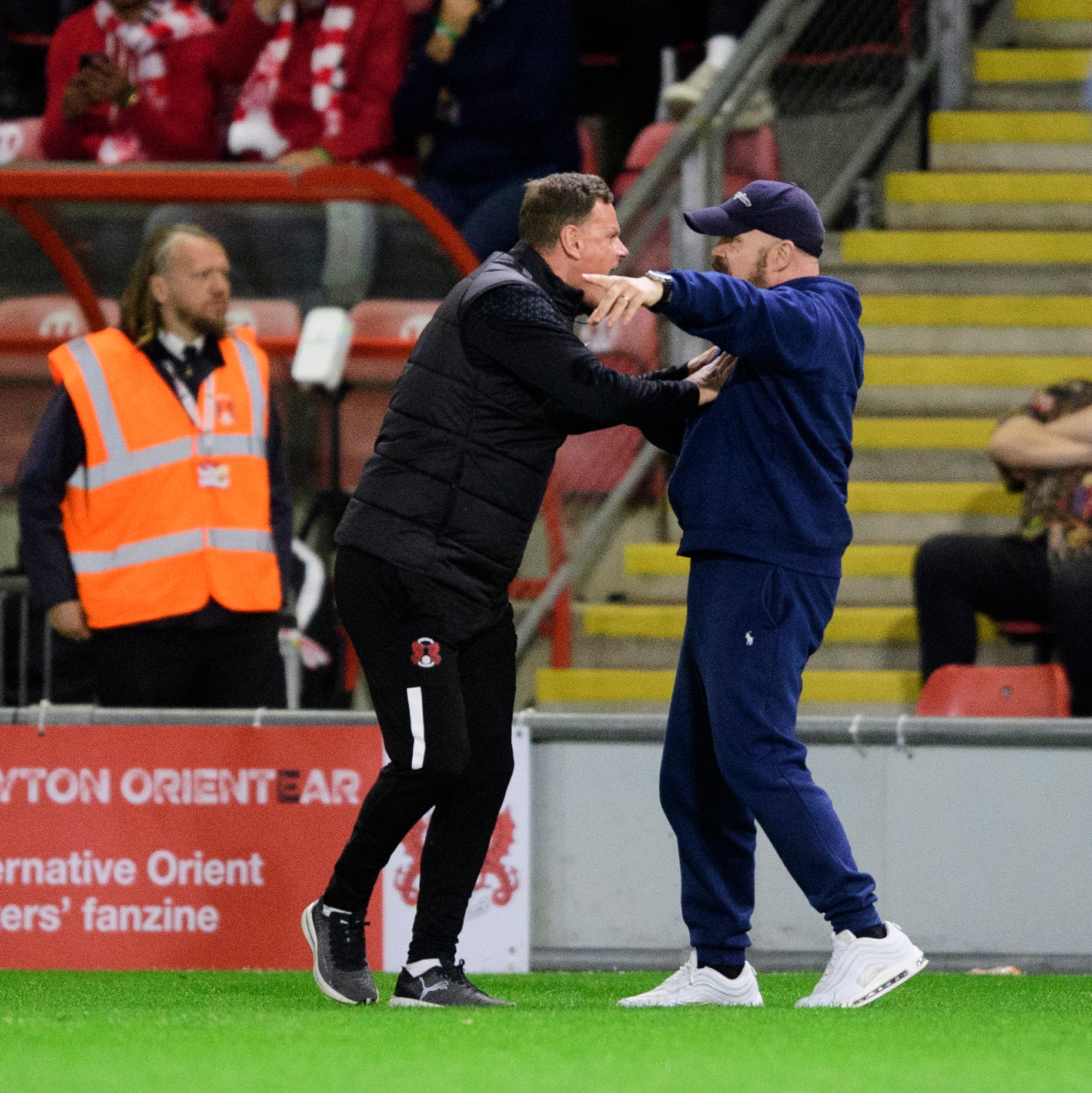 Leyton Orient’s manager Richie Wellens clashes with a fan