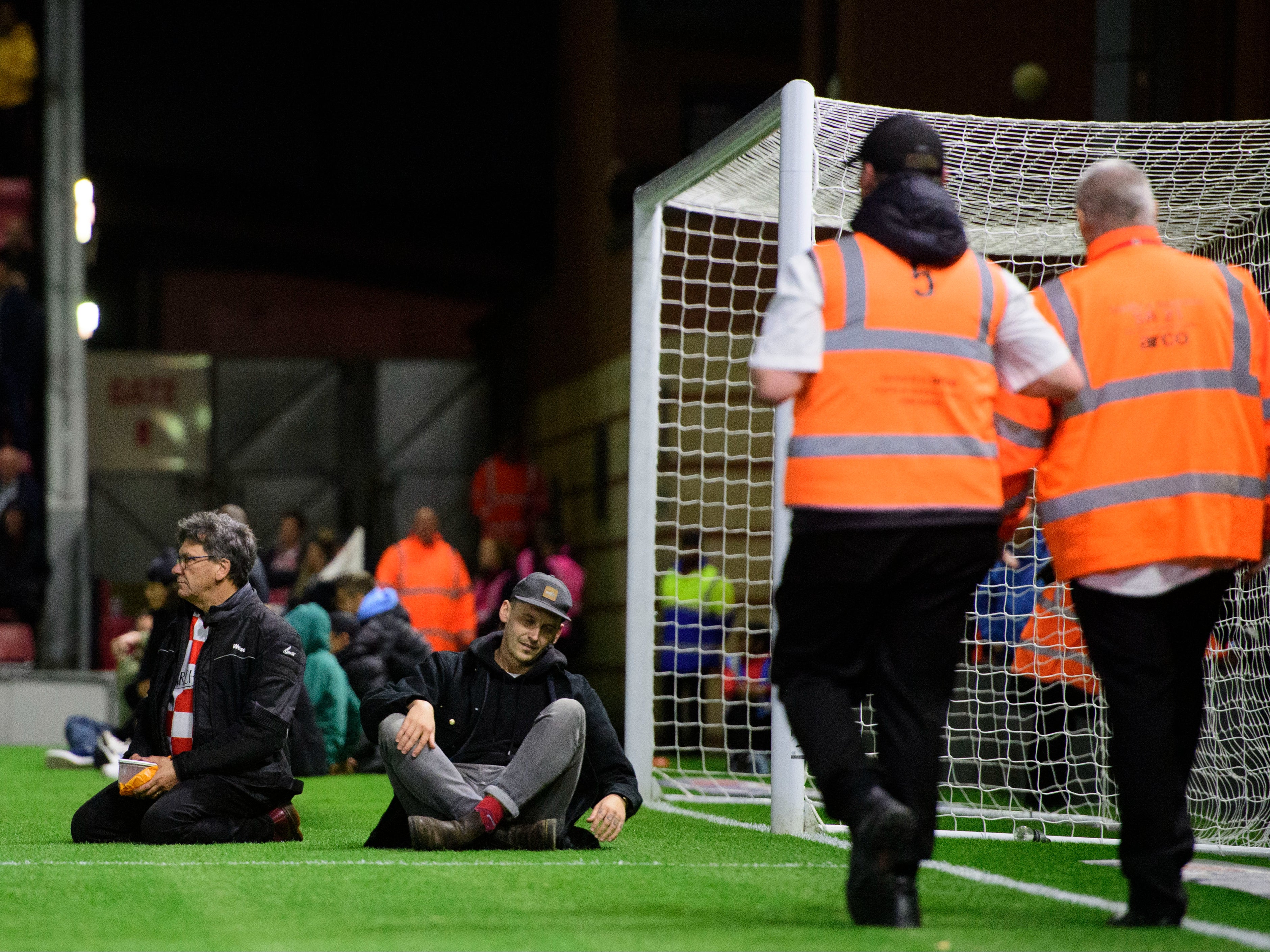 Fans sat in the goalmouth to get attention to Mr Reynold’s plight