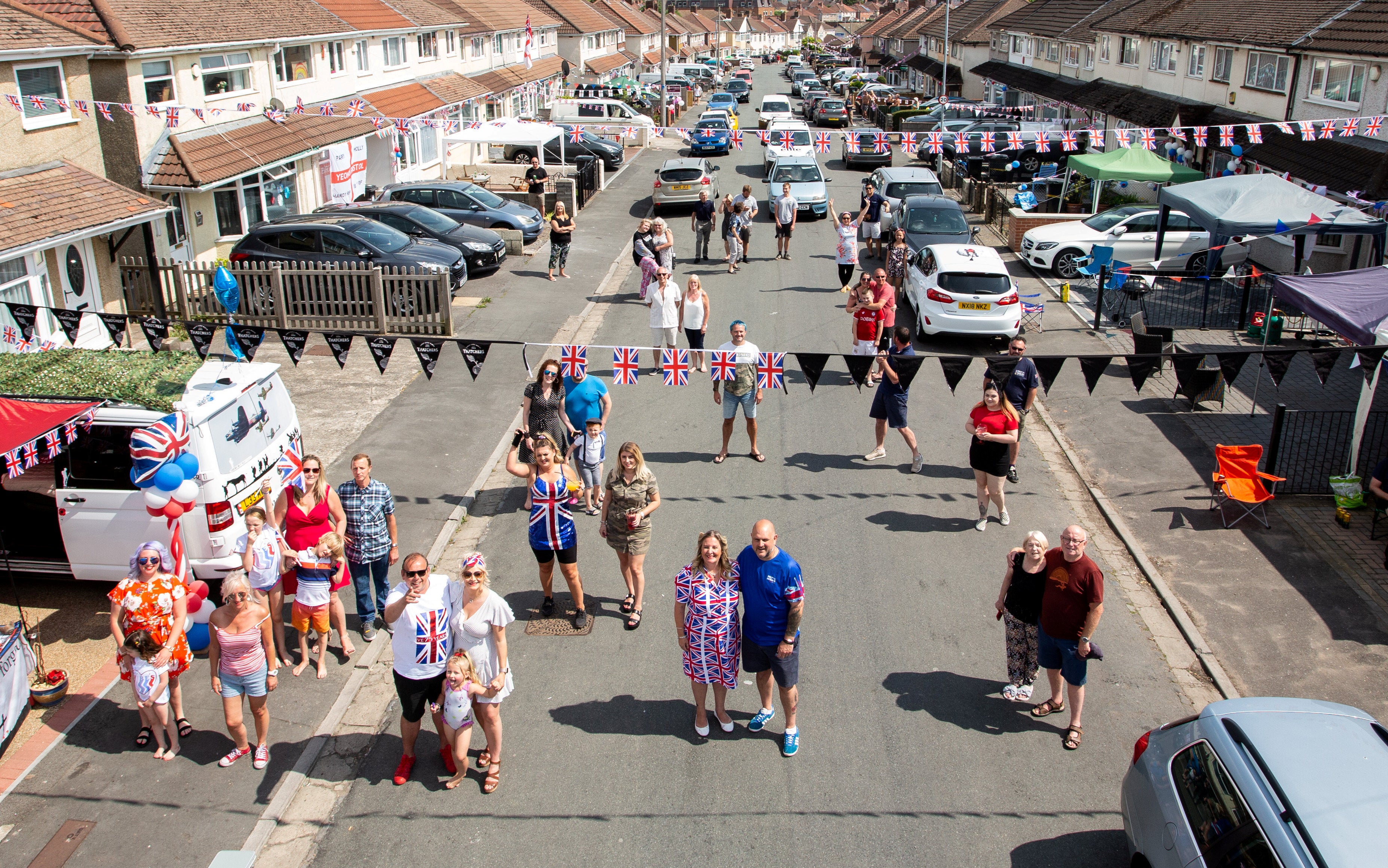 Residents on Novers Park Road in Knowle, Bristol enjoy a social distancing street party to celebrate the 75th anniversary of Victory in Europe Day in 2020.