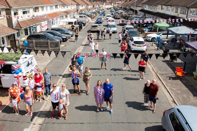 <p>Residents on Novers Park Road in Knowle, Bristol enjoy a social distancing street party to celebrate the 75th anniversary of Victory in Europe Day in 2020.</p>