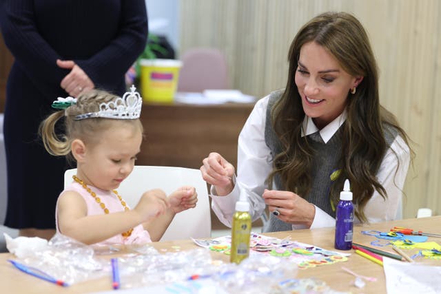 The Princess of Wales helps a young girl at an arts and crafts session at the Vsi Razom Community Hub in Bracknell, Berkshire (Chris Jackson/PA)