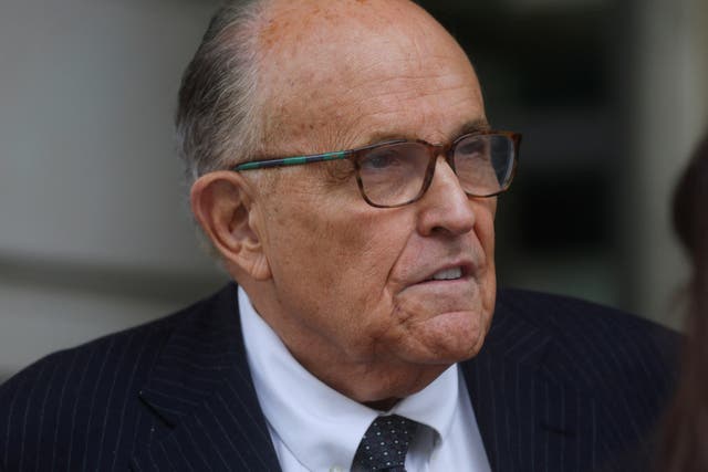 <p>Rudy Giuliani leaving U.S. District Court after attending a hearing in a defamation suit related to the 2020 election results</p>