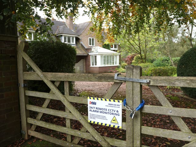 <p>A padlock on the gates of a house on Heath Road, Whitmore Heath in the West Midlands, where 70 per cent of homes have been purchased for HS2</p>