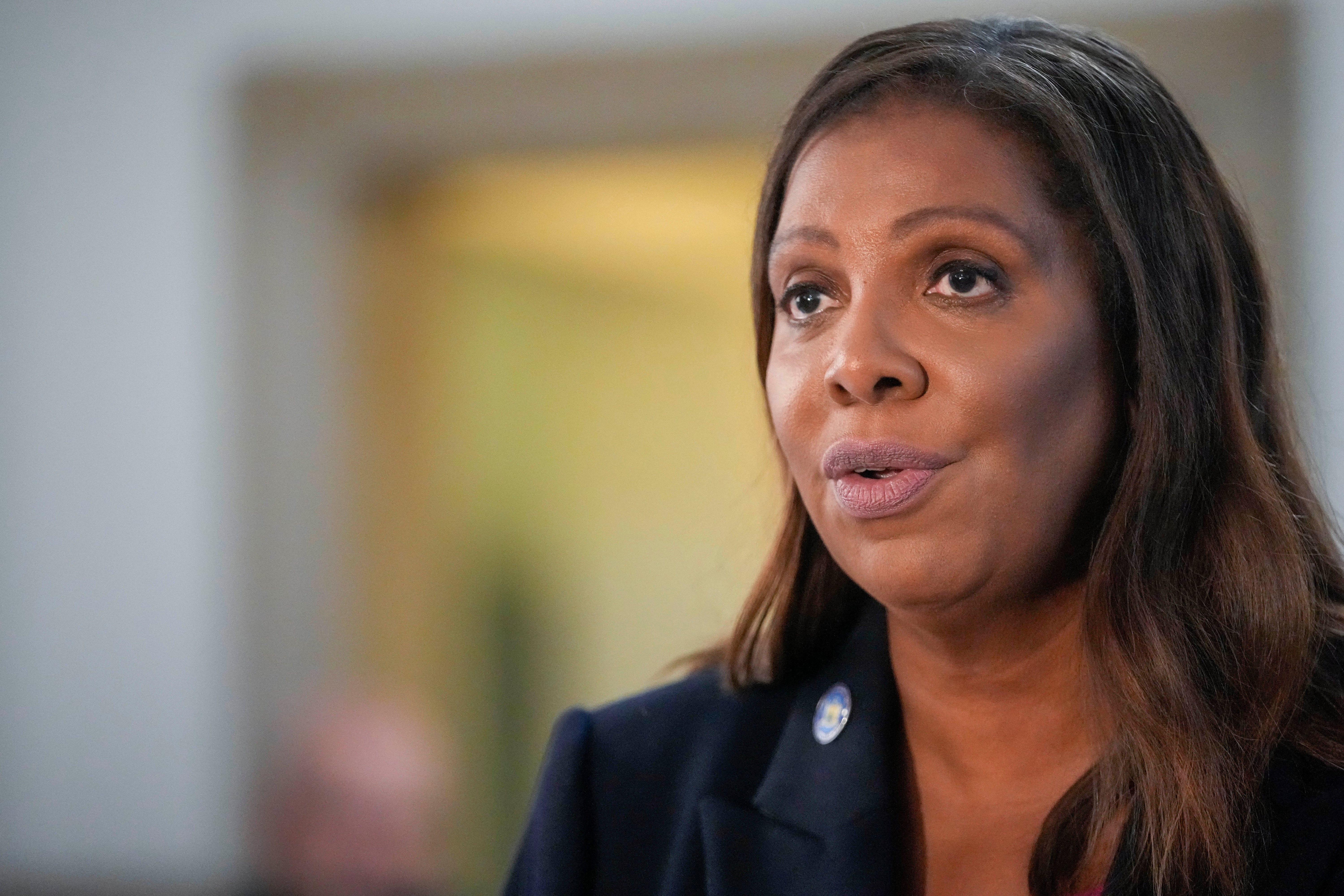 New York Attorney General Letitia James speaks to reporters on 4 October during a break in a trial stemming from her lawsuit against Donald Trump and his business empire.