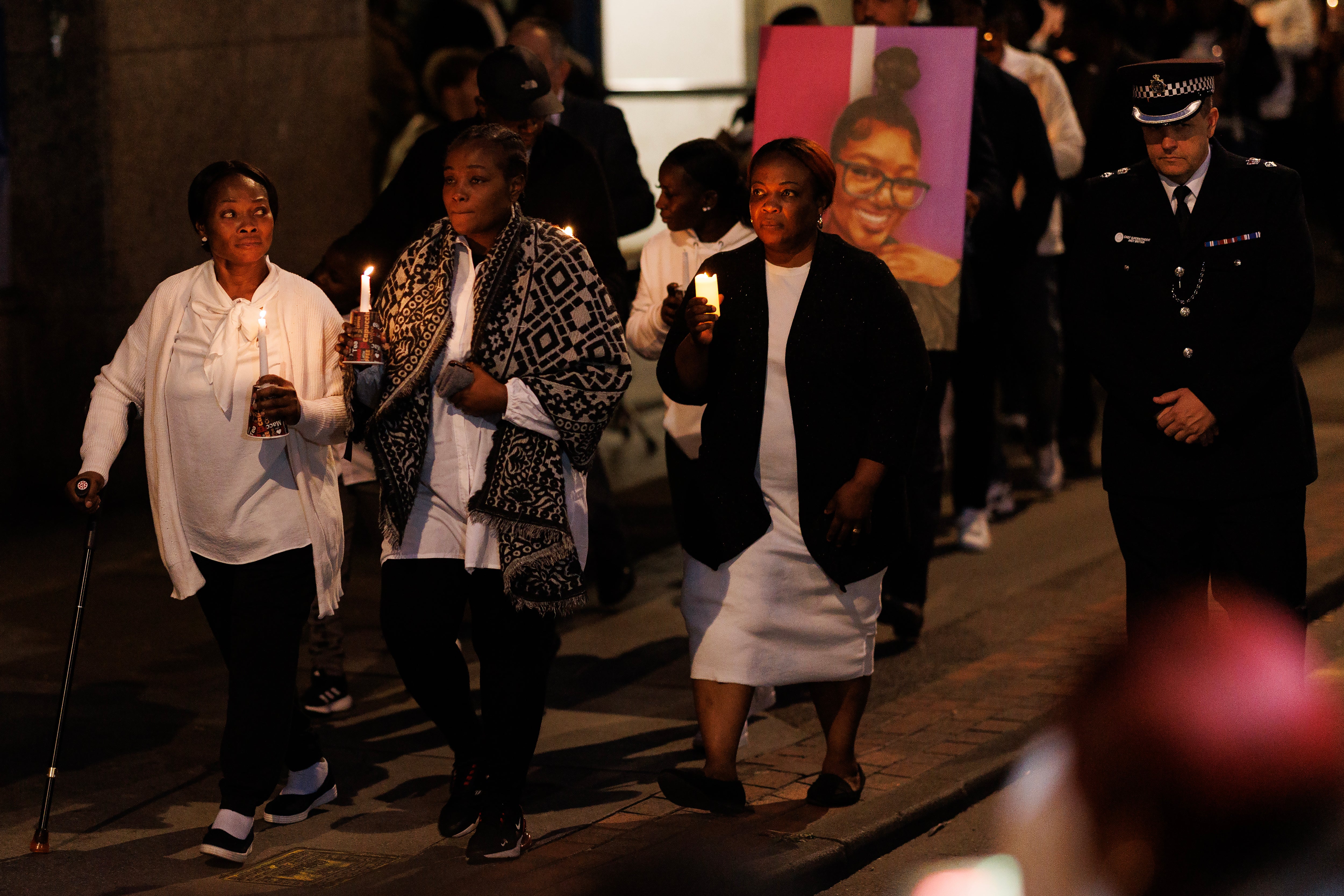 The mother of Elianne Andam arriving with other family members and friends at a vigil for her daughter last year