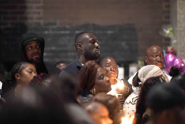 Stormzy joins people attending a vigil outside the Whitgift shopping centre in Croydon (Yui Mok/PA)
