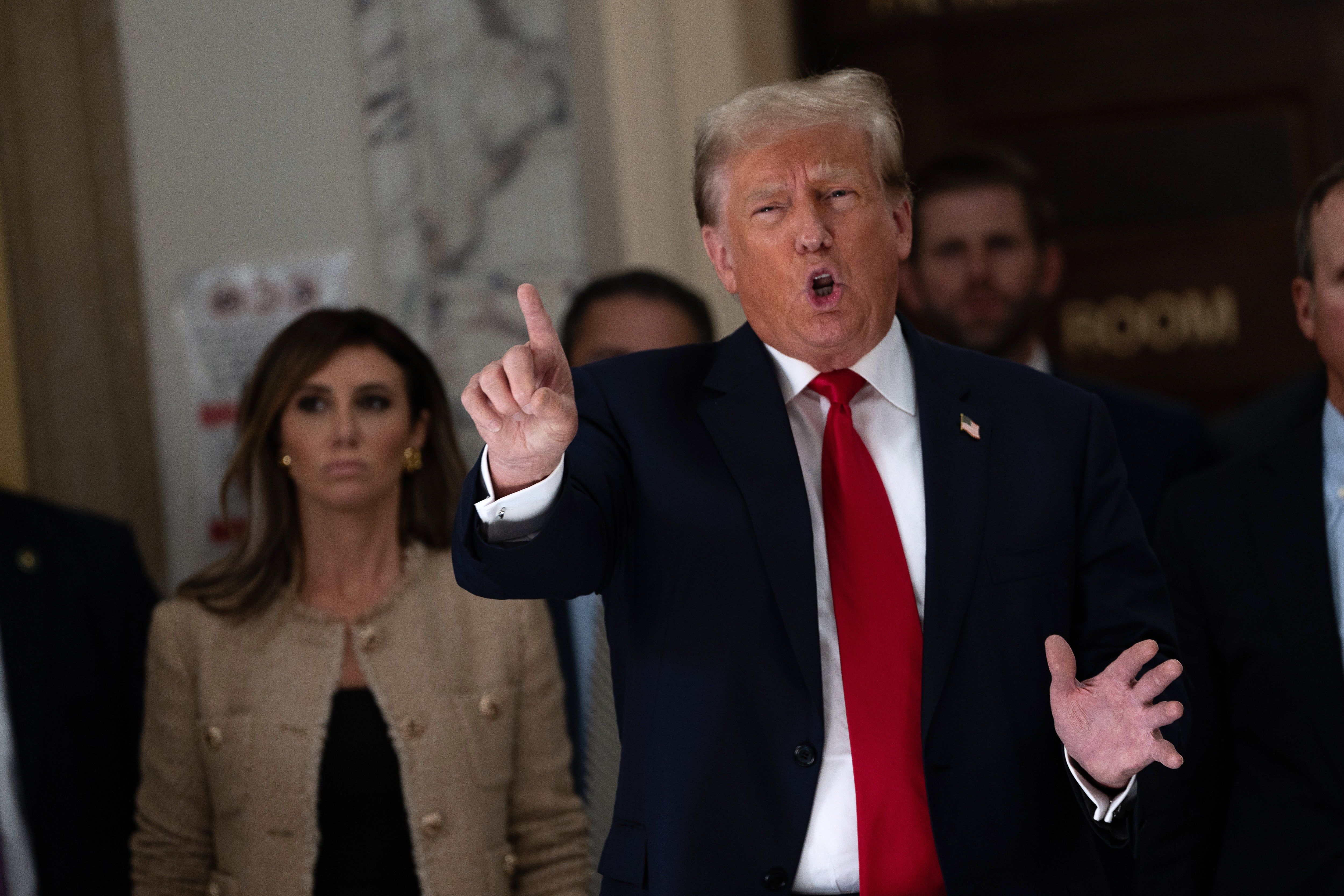 Former President Donald Trump addresses the press during a lunch break on the third day of his civil fraud trial at New York State Supreme Court on 4 October 2023