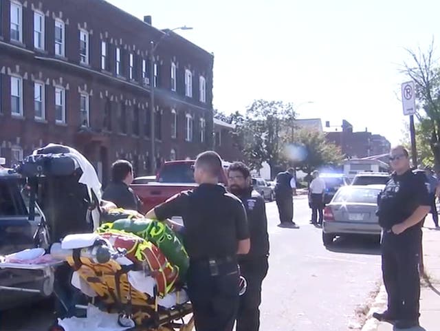 <p>First responders with a stretcher wait near an intersection in Holyoke, Massachusetts after a shooting left multiple people injured</p>