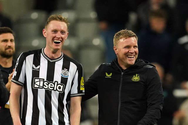 Newcastle head coach Eddie Howe celebrates with midfielder Sean Longstaff after the final whistle at St James’ Park (Martin Rickett/PA)