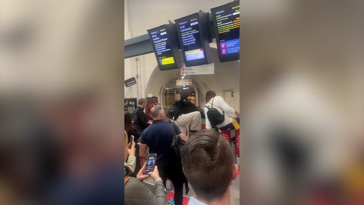 <p>Commuters jump barriers to try and catch train as strikes hit Britain.</p>