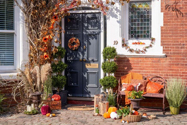 From seasonal wreaths to faux flowers, decorating your front door has never been so on-trend (Wayfair/PA)