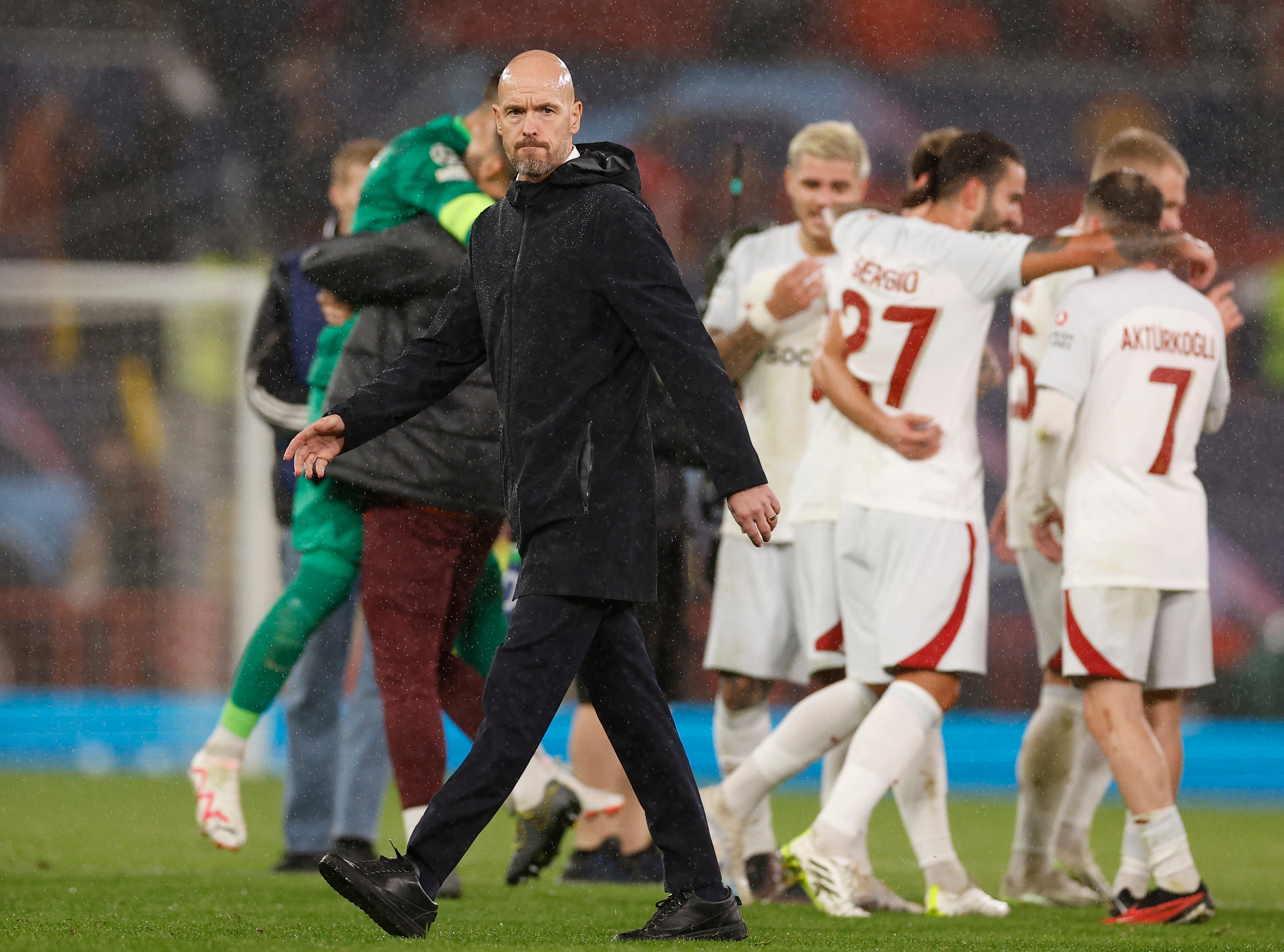 Erik Ten Hag walks off after Manchester United’s defeat to Galatasaray
